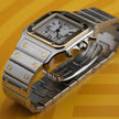 A Cartier watch with a silver-toned stainless steel case and bracelet, a gold-toned bezel, and a white dial with Roman numerals, set against a yellow background.